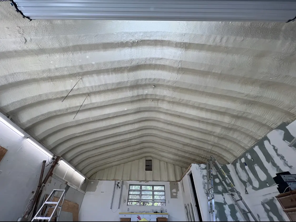Spray polyurethane foam applied to the underside of a metal roof deck in Dallas